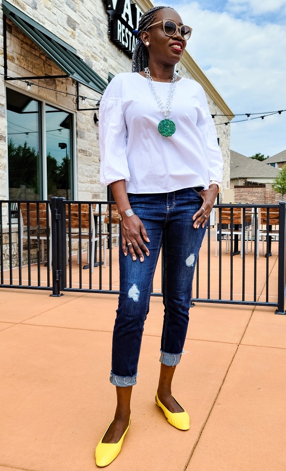 Fall style white top and blue jeans