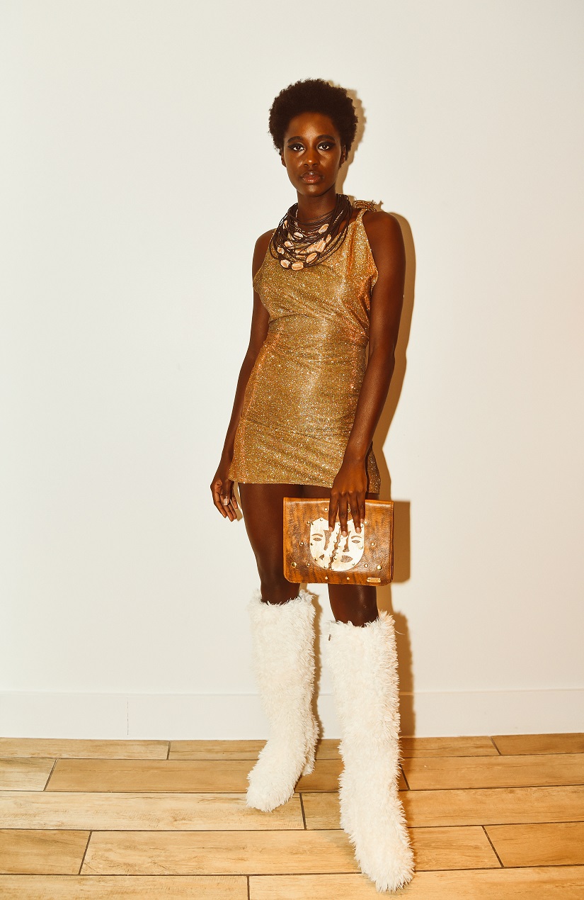 Model in Zuri Perle leather handcrafted clutch backstage at new york fashion week runway accessories