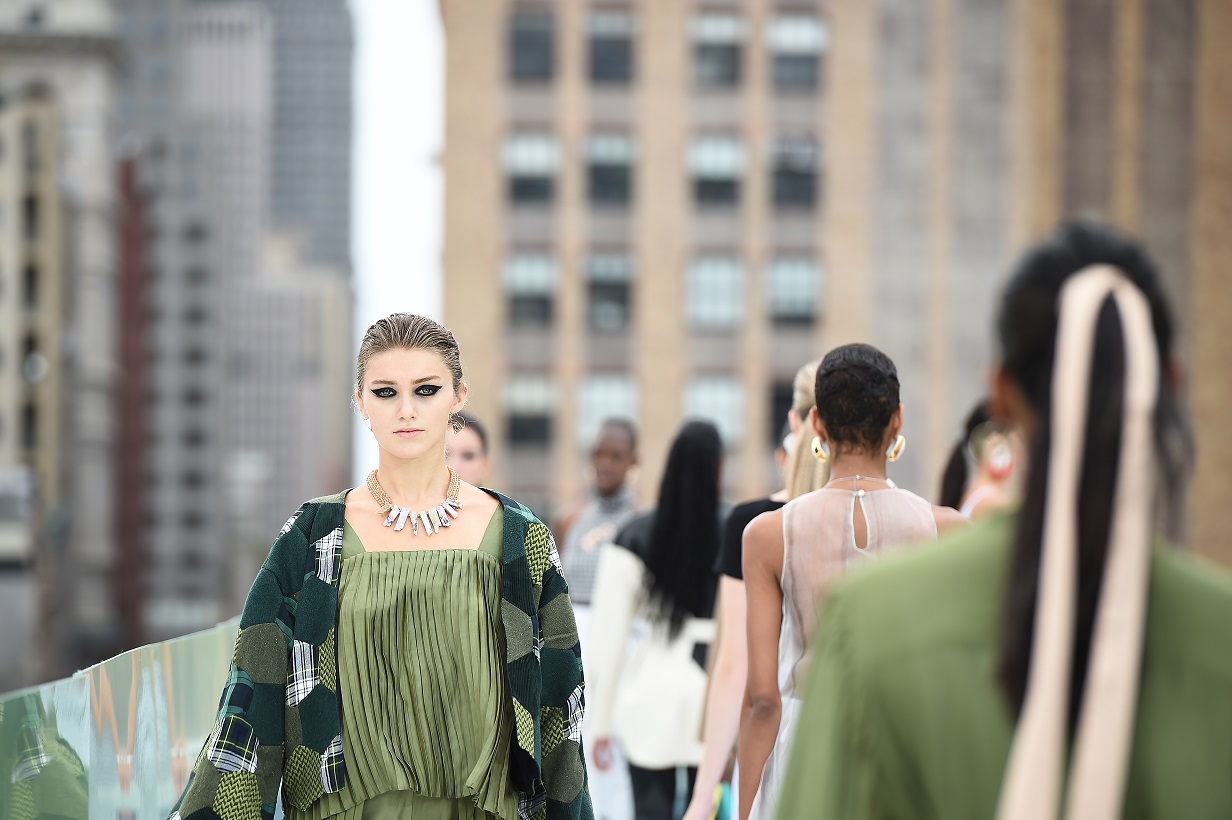 Model in Zuri Perle Iboju handcrafted pink opal statement necklace on the runway at new york fashion week runway accessories