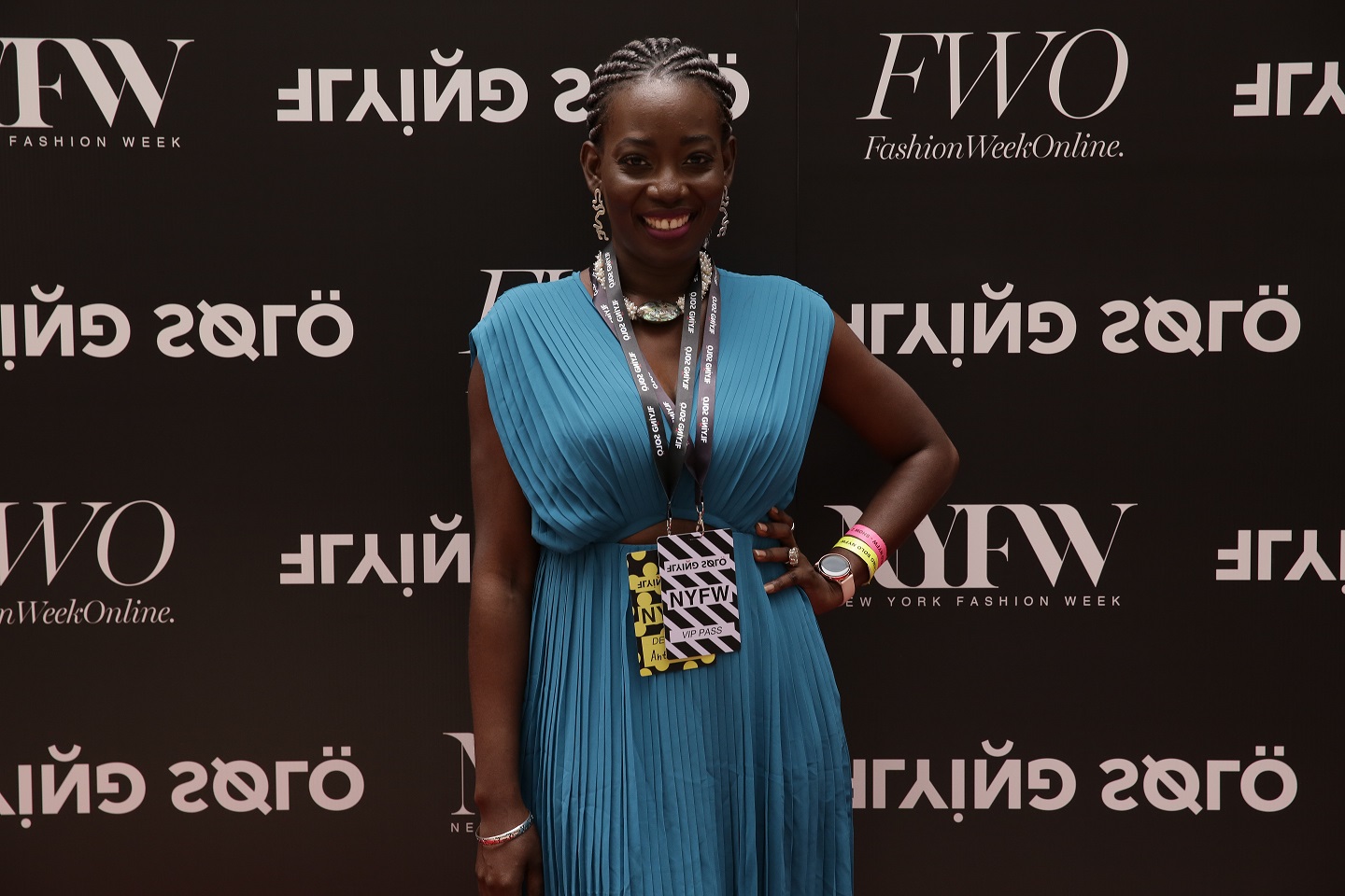 Atinuke Adeleke Owner Zuri Perle on the red carpet at new york fashion week runway accessories Iyun coral Sterling Silver handcrafted statement earrings